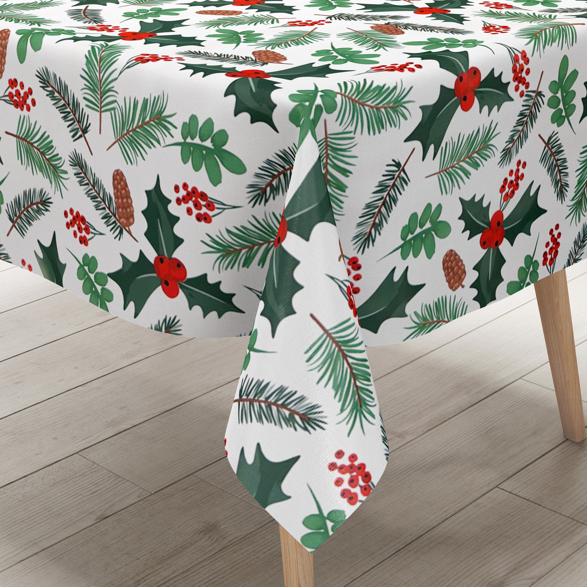 Weihnachtliche Wachstuch-Tischdecke auf weißem Hintergrund mit Tannenzweigen, Tannenzapfen, grünen Blättern und roten Beeren in einem leichten, natürlichen Muster.