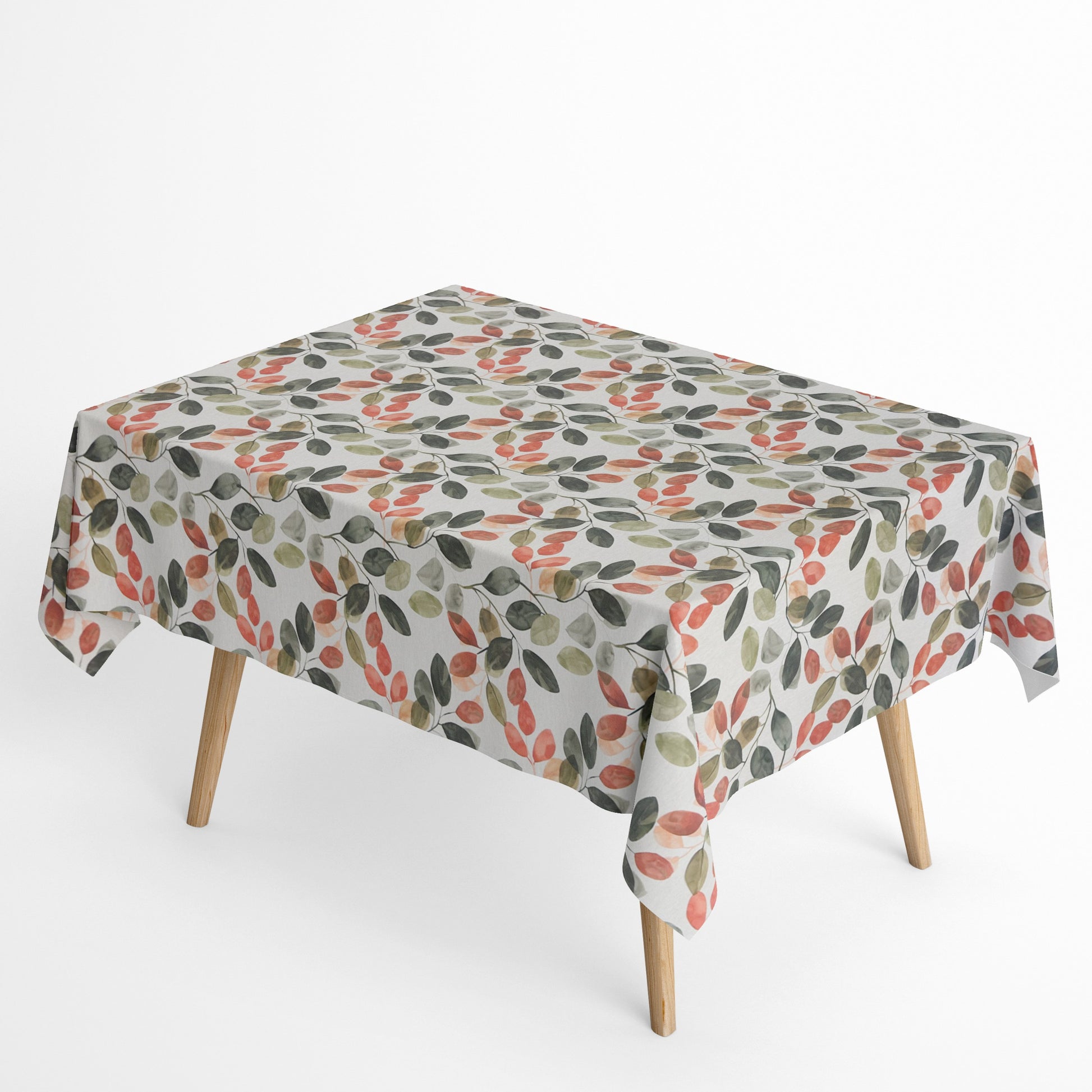 Beschichtete Baumwoll-Tischdecke mit modernem Blattmuster auf hellem Hintergrund. Aquarellartige Blätter in Grün-, Oliv-, Korall- und Apricottönen hängen an feinen Zweigen und verteilen sich gleichmäßig über die Oberfläche.