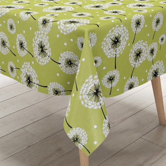Wachstuch-Tischdecke mit weißen Pusteblumen in verschiedenen Größen auf hellgrünem Hintergrund. Schwarze Stiele und kleine weiße Punkte ergänzen das verspielte, natürliche Design mit leichter, frischer Ausstrahlung.