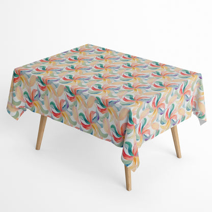 Die Jacquard Tischdecke aus beschichteter Baumwolle zeigt ein modernes, fließendes Muster aus geschwungenen Blattformen in sanften Pastellfarben wie Grün, Blau, Gelb und Rot.