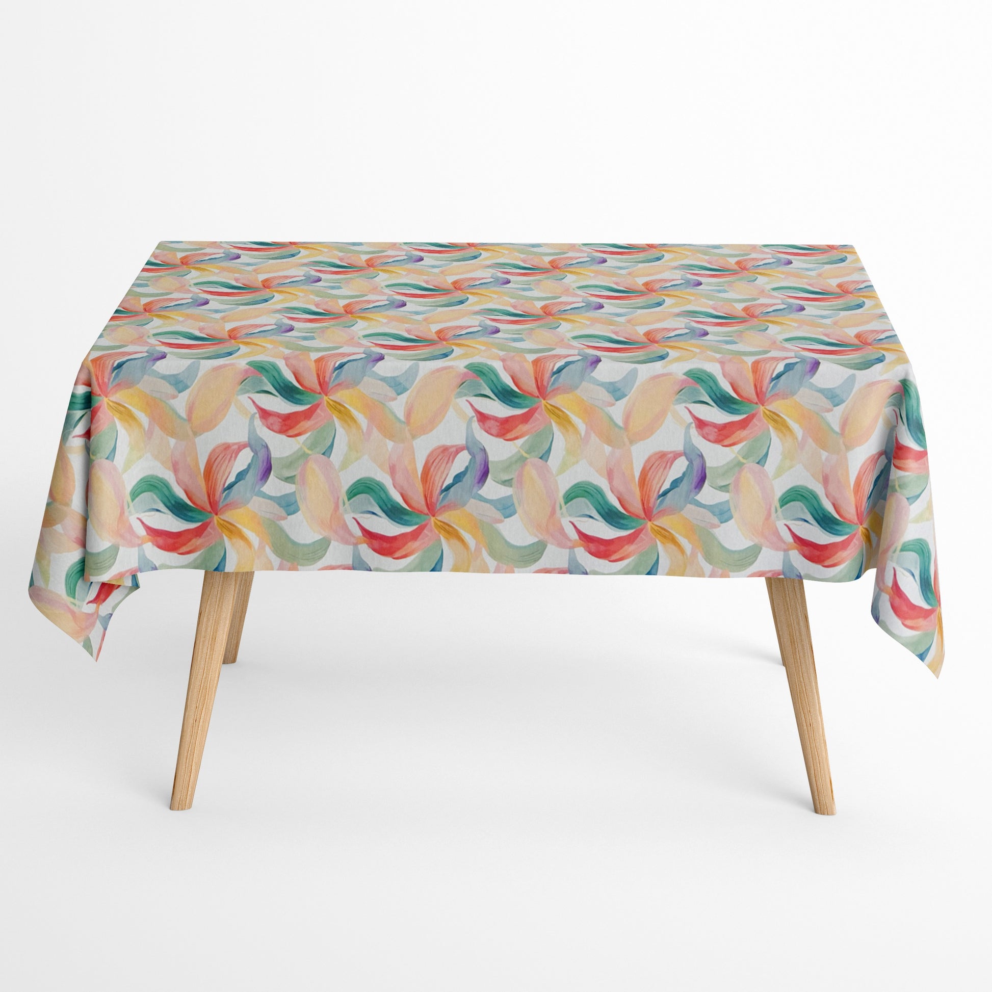 Die Jacquard Tischdecke aus beschichteter Baumwolle zeigt ein modernes, fließendes Muster aus geschwungenen Blattformen in sanften Pastellfarben wie Grün, Blau, Gelb und Rot.