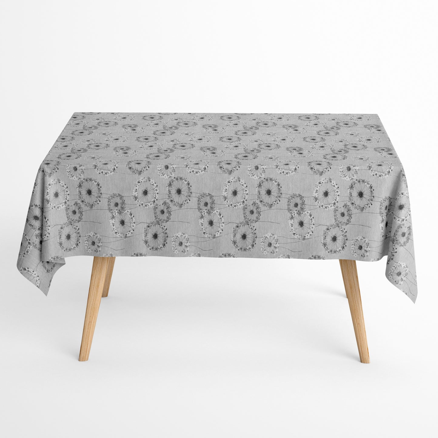 Jacquard-Tischdecke mit filigranem Blumenmotiv aus stilisierten, fein gezeichneten Blüten in Grau- und Weißtönen. Beschichtete Baumwolle mit praktischem Fleckenschutz.