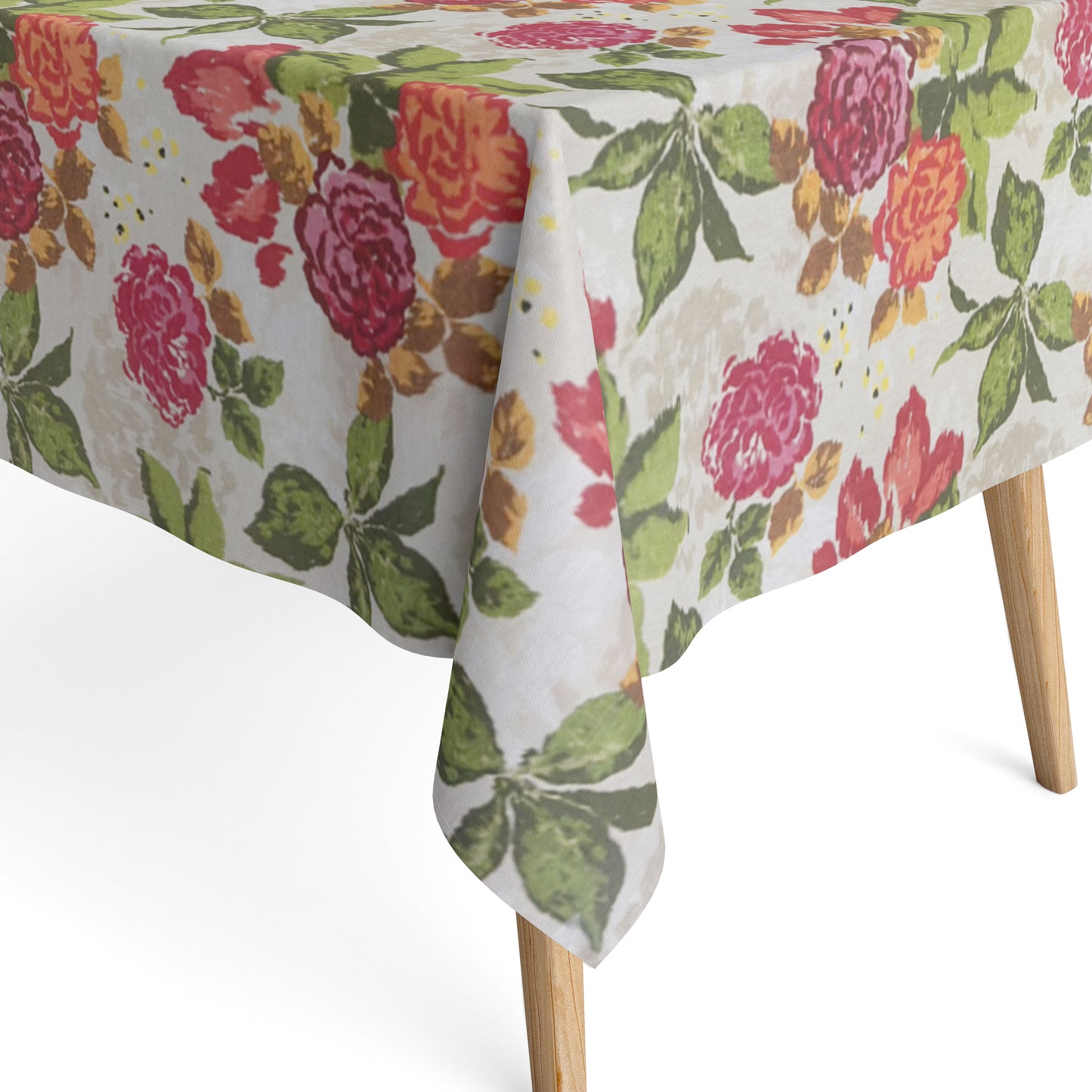 Beschichtete Baumwoll-Tischdecke mit großem floralem Muster auf hellem Hintergrund. Auffällige Blüten in Pink, Rot und Orange sowie grüne Blätter verteilen sich über die Oberfläche. Über eine Tischecke drapiert, mit sichtbaren hellen Holzbeinen.